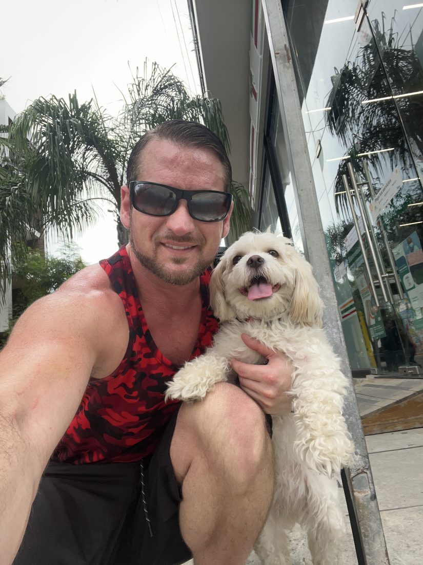 Adam and Maya smiling outside
